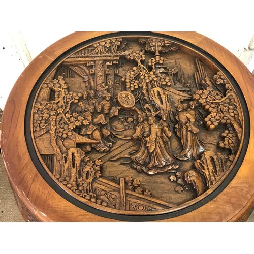 13 - Profusely Carved Oriental Circular Table With Four Pull Out Stools. 80 cms Diameter X 52 Cms High