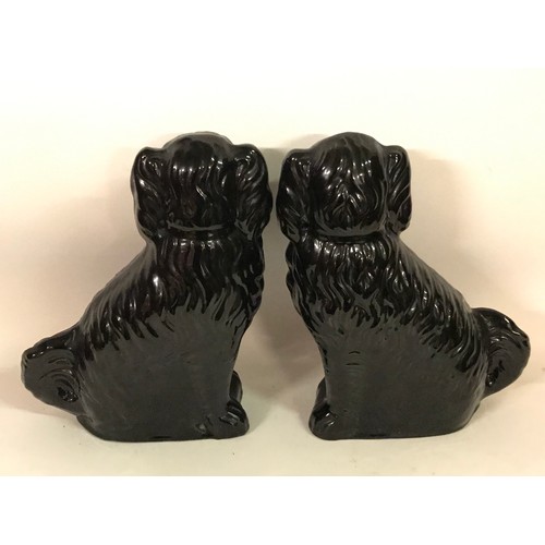 130 - Pair Of Black Staffordshire Style Ceramic Dog Figures. 30 cms High