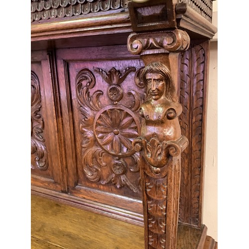 1 - Two Piece Carved Wood European Cabinet With Carved Wood Figural Adornments . 47 x 108 x 183 cms