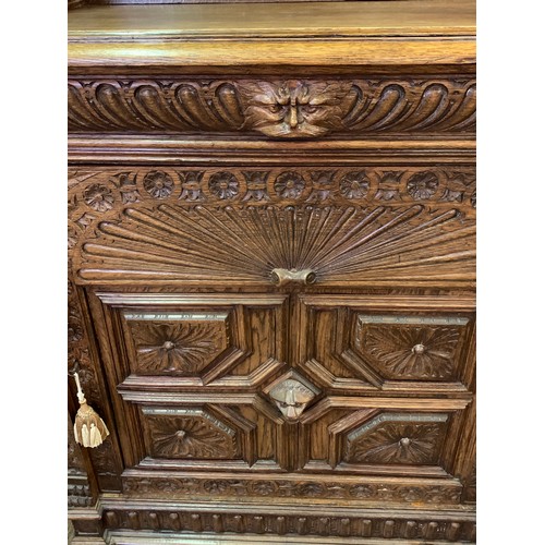 1 - Two Piece Carved Wood European Cabinet With Carved Wood Figural Adornments . 47 x 108 x 183 cms