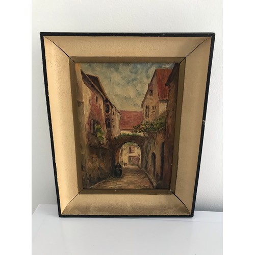 121 - Framed And Signed Continental Oil Painting On Board Of A Village Scene  23 x28 cms