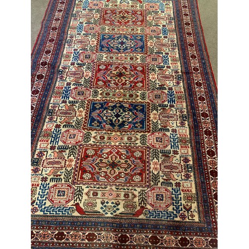 301 - Decorative Hand Tied Ground Rug With Central Motif And Border Decoration. 280 x 164 cms