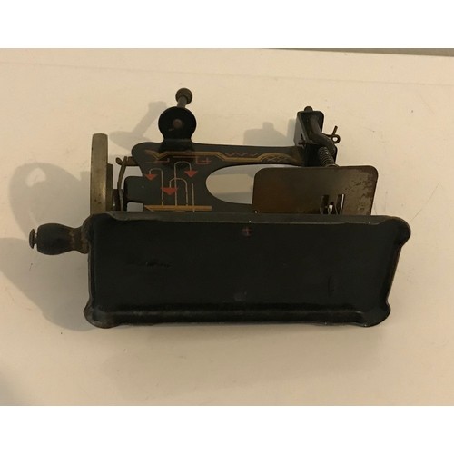 129 - Vintage Toy Child’s Sewing Machine With Vivid Painted Decoration Probably German
13 cms h x 13 cms w