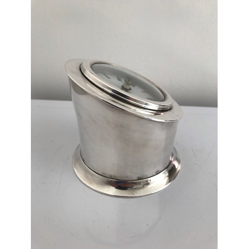 133 - Silver Plated Clock Case
9 cms high (rear) and 5 cms (front). 10 cms diameter