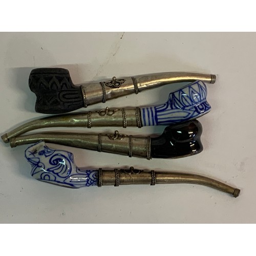 266 - Four Oriental Ceramic Head Pipes (4)