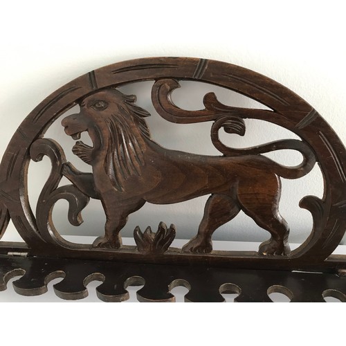 107 - Antique Pipe Rack Having A Carved Lion Motif
43 cms wide x 20 cms high