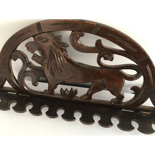 107 - Antique Pipe Rack Having A Carved Lion Motif
43 cms wide x 20 cms high