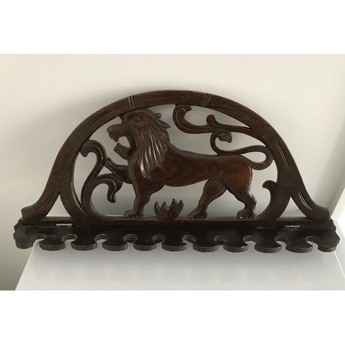 107 - Antique Pipe Rack Having A Carved Lion Motif
43 cms wide x 20 cms high