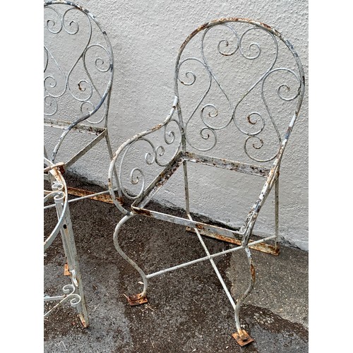 68 - Two Vintage Metal Garden Chairs Along With A Circular Metal Garden Table. (3)