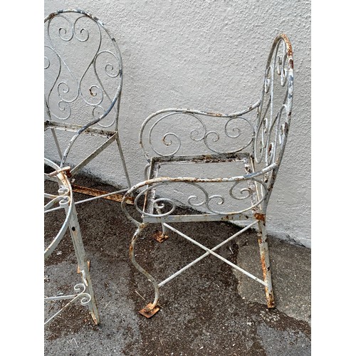 68 - Two Vintage Metal Garden Chairs Along With A Circular Metal Garden Table. (3)