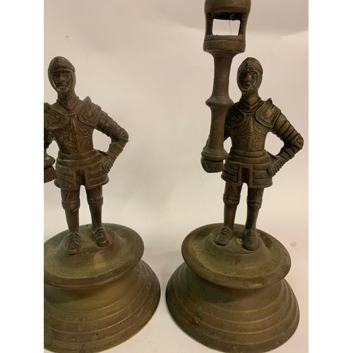 327 - Pair Of Solid Brass Candlesticks In The Form Of Nights. 23 cms High