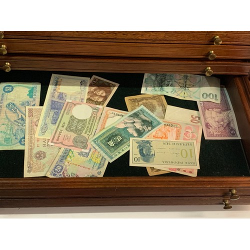 330 - A Collectors Case Of Drawers Along With Contents Of Banknotes And Coins. 52 x 38 x 30 cms