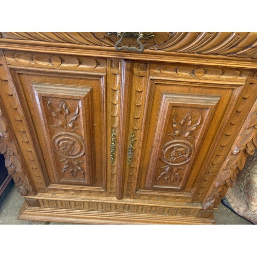 81 - Carved Wood Decorated European Cabinet. 94 x 46 x 102 cms