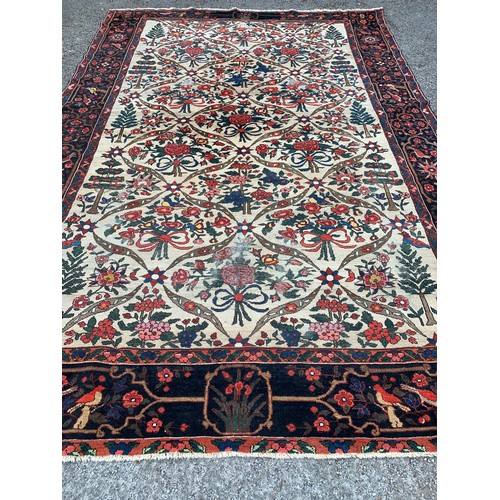 90 - Large Hand Knotted Rug With Decorative Bird And Flower Border And Large Central Motif. 383 x 257 cms