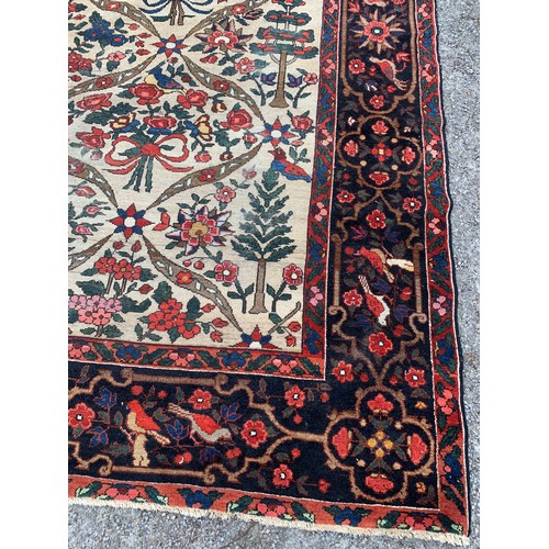 90 - Large Hand Knotted Rug With Decorative Bird And Flower Border And Large Central Motif. 383 x 257 cms