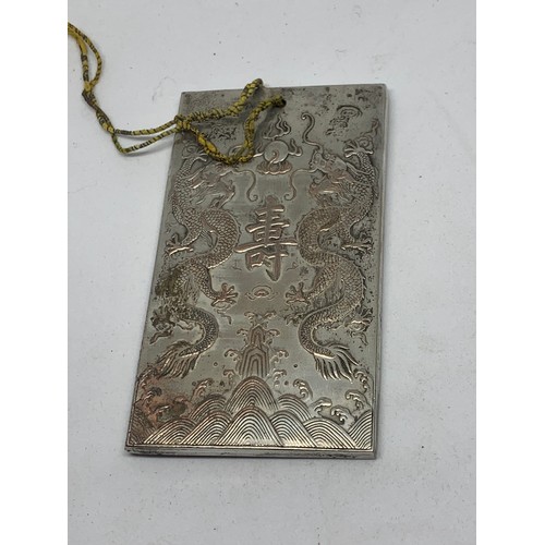 435 - Unusual Oriental Possibly Silver Plaque With Chinese Decoration. 9.5 x 5.5 cms