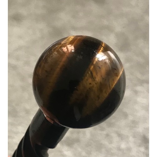 123 - Antique Ebony Walking Cane (small repair) With Tiger Eye Finial Having A Stamped Silver Collar