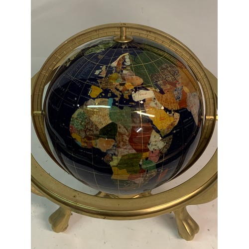 439 - Table top semi-precious stone inlaid terrestrial globe of the world Set In A Bras Frame. 35 cms High