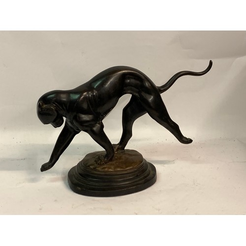 444 - A Mounted Bronze Figure Of A Cougar. 45 x 28 cms