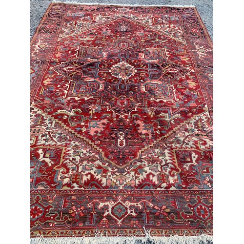 99 - Large Ground Rug With Decorative Border And Large Central Motif 328 x 234 cms