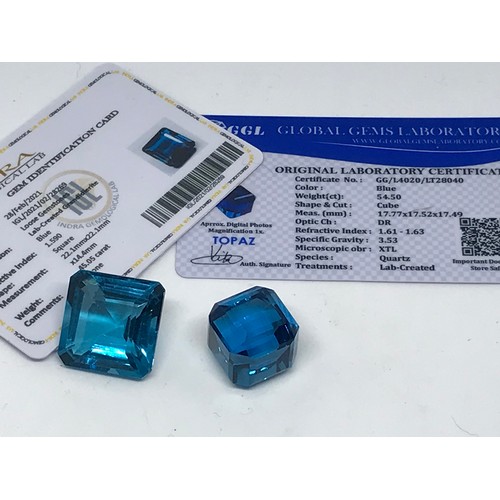 307 - Two Loose Gemstones A Square Cut 45.05 Carat Blue Grandidierite And A 54.50 Cube Cut Blue Topaz (2) ... 