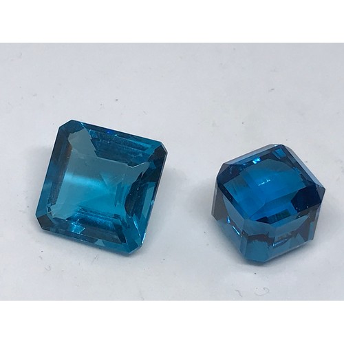 307 - Two Loose Gemstones A Square Cut 45.05 Carat Blue Grandidierite And A 54.50 Cube Cut Blue Topaz (2) ... 