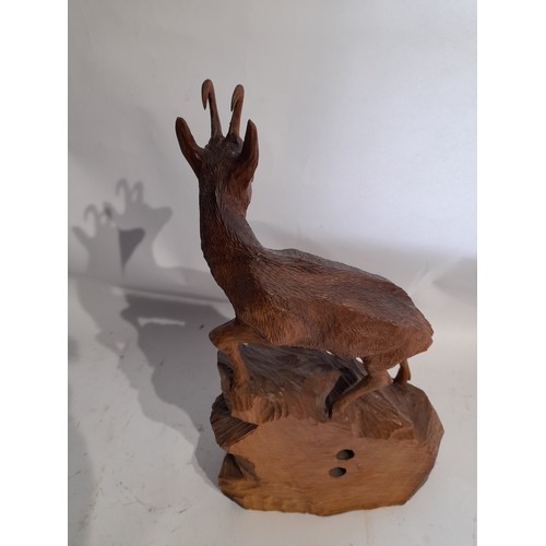 5 - Black Forest style Hand Carved Ibex with Barometer. signed to lower left. 43cm high x 23cm wide