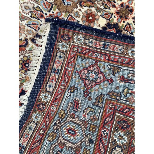 91 - Decorative Hand Tied Ground Rug With Central Pattern 254 x 165 cms