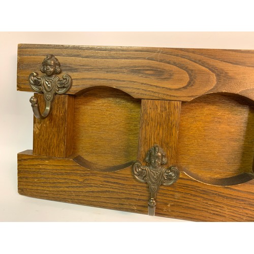 77 - French Coat Hook Shelf With Five Cherub Hooks. 66 x x21 cms