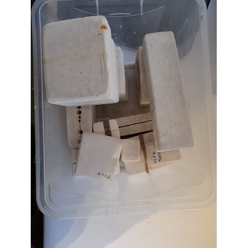 96 - Box containing a quantity of Seeley Doll Part Molds to include legs and arms