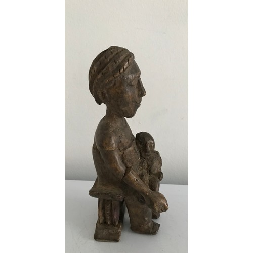 127 - Antique Ashanti Carved Wooden Statue Of A Seated Madonna And Child
19 cms h