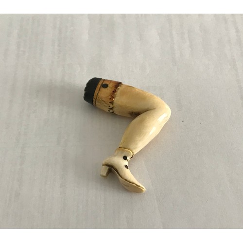 144 - Carved Ivory Pipe Tamper In The Form Of Ladies Leg 
5.5 x 3 cms