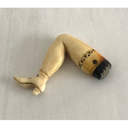 144 - Carved Ivory Pipe Tamper In The Form Of Ladies Leg 
5.5 x 3 cms