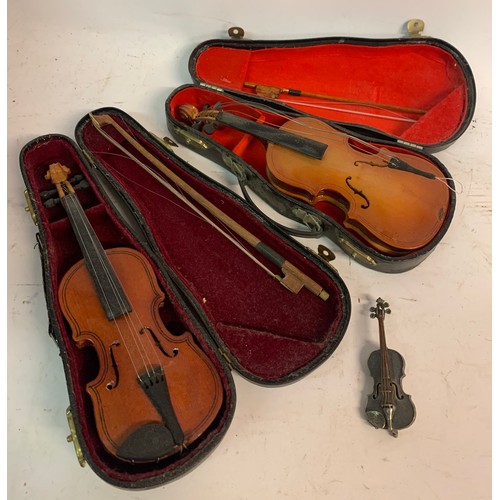 565 - Two Vintage Cased Miniature Violins Along With A Violin Brooch, (3)