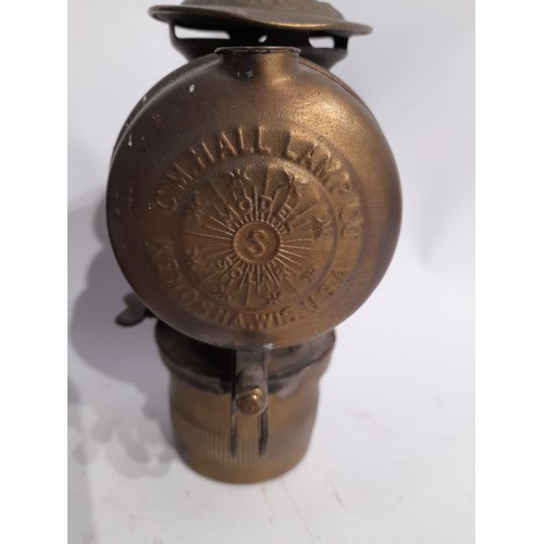 232 - Shell Case dated 191723cm high and a Brass Cycle lamp by CM HALL LAMP Co USA