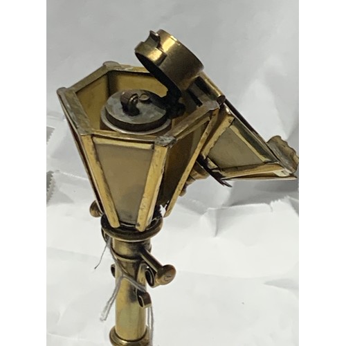 82 - Antique Novelty Lighter in The Form Of A Streetlamp. 24cms High