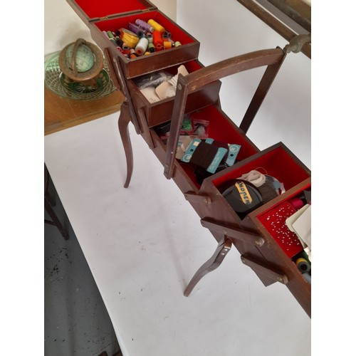 3 - Mid century Cantilever sewing box on legs with contents. 50cm wide x 70cm high to top of handle