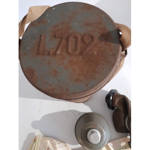 50 - WW2 Gas mask with instructions in canister marked L702 to lid