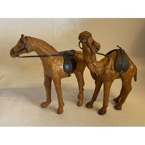 5 - Two Leather Clad Figures , A Horse And A Camel. Tallest 20 cms High (2)