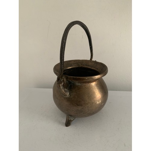 126 - 17thC Bronze Cauldron With Later Additions Having Swing Handle
10 cms diameter x 18 cms h (with hand... 