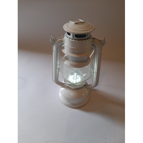 28 - Metal Battery LED Storm lamp in working condition. 25cm high