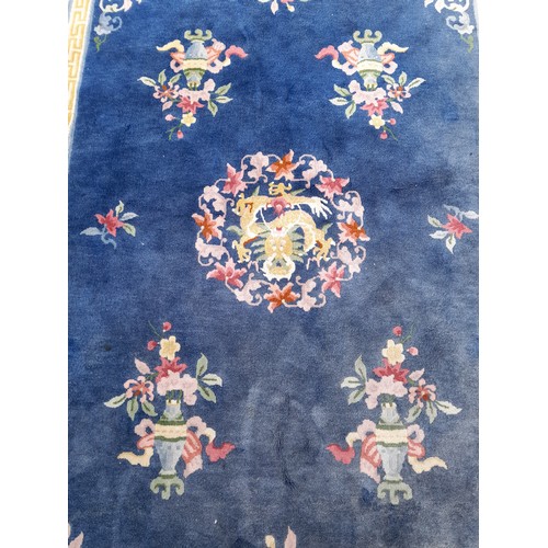 86 - Large Blue Decorative Hand Tied Ground Rug. 290 x 186 cms