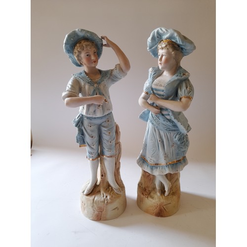 46 - Pair of continental ceramic figures of a young man and young lady, 37cm high