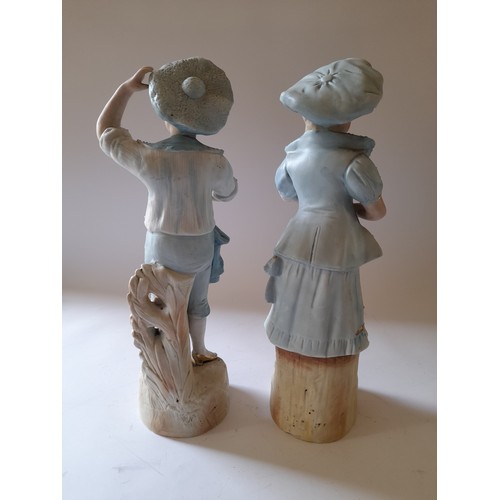 46 - Pair of continental ceramic figures of a young man and young lady, 37cm high