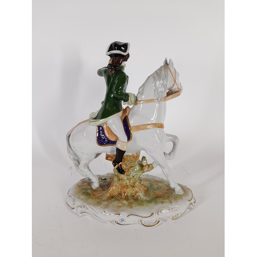 52 - continental ceramic figure of a horseman on horseback,29cm x 25cm