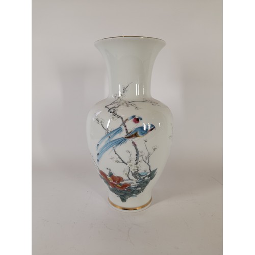 55 - Decorative vase standing 34cm high featuring a Japanese style scene