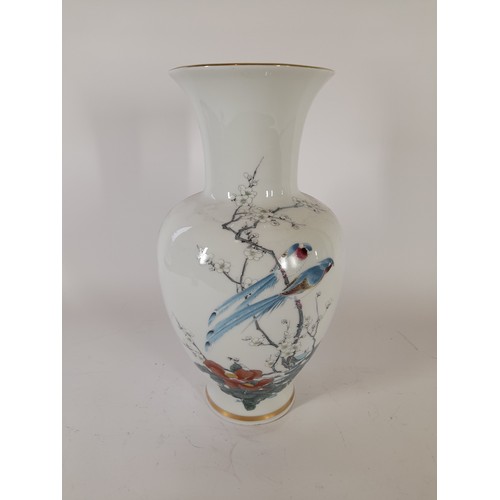 55 - Decorative vase standing 34cm high featuring a Japanese style scene