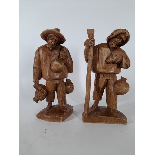 59 - A pair of wood carved figures, 22cm high