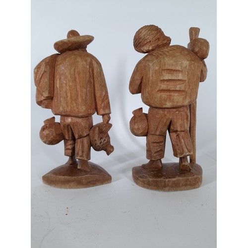 59 - A pair of wood carved figures, 22cm high