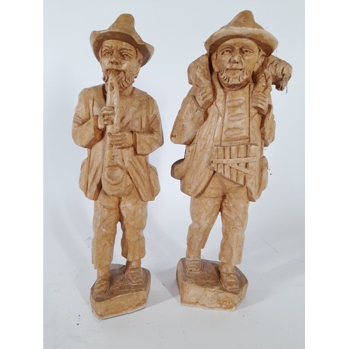 74 - Pair of wood carved figures standing 28cm high